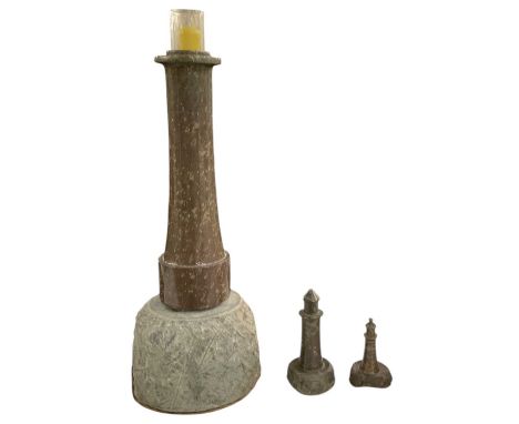 A modern lizard rock and carved marble table lamp, modelled as a lighthouse, height 53cm, and two smaller matching lighthouse