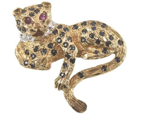 A 9ct yellow gold sapphire, ruby and diamond set brooch modelled as a leopard, set with approximately forty-five small sapphi