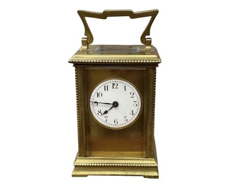 A late 19th/early 20th century French brass cased four glass carriage clock, the white enamel dial set with Roman numerals an