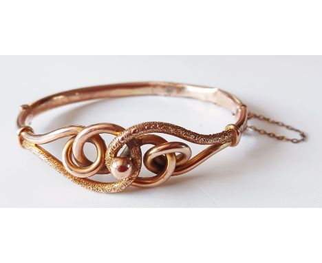 9CT GOLD BANGLE WITH SAFETY CHAIN. 10.4g
THIS LOT IS IN SECURE STORAGE, VIEWING BY APPOINTMENT ONLY  NO. 3