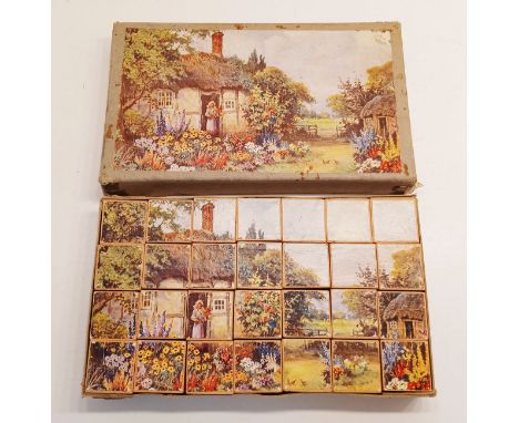 A VINTAGE ABC BLOCK PUZZLE SET IN ORIGINAL BOX