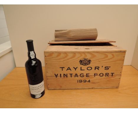 A Twelve bottle case of 1994 Taylor's Vintage Port, bottled in 1996 by Taylor Fladgate &amp; Yeatman, all 20% vol, 75cl, in o