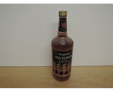A bottle of 1970's Seagram's 100 Pipers De Luxe Scotch Whisky, distilled and blended in Scotland Joseph E Seagram &amp; Son L