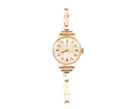 Tissot - a lady's wristwatch, 18mm circular baton dial with only one hand, in a 20mm case, fitted with a 9 carat yellow gold 