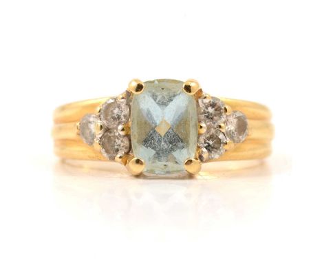 An aquamarine and diamond ring, the rectangular faceted aquamarine, 7x5mm four claw set and flanked by three brilliant cut di