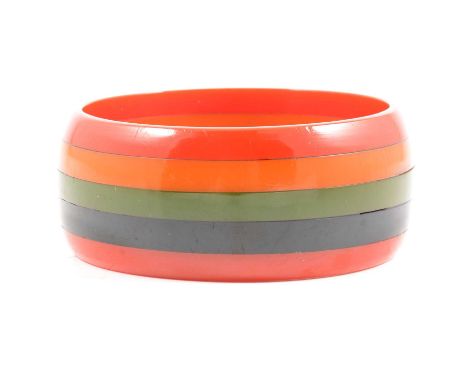 An Art Deco Bakelite Five Band Philadelphia Bangle, 30mm wide half D shape formed from red, yellow, green, black, red bands, 