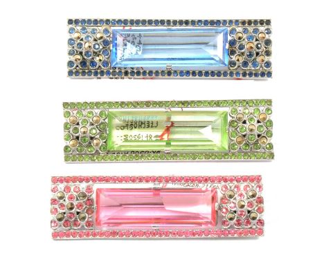 Seventeen vintage coloured paste set brooches highlighted with marcasite, three matching 60mm bar brooches, pink, green and b