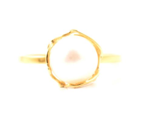 An 8.5mm cultured pearl set in an 18 carat yellow gold wire cage on a 1.5mm wide band ring size O, new and unworn.