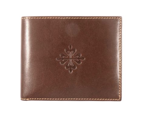 Patek Philippe Geneve- a brown leather wallet, 11x9cm, embossed with an emblem, as new and boxed.Condition report:Please see 