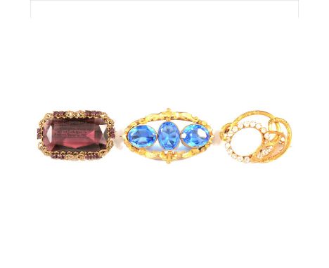 Twenty-seven vintage coloured paste set brooches, a gilt metal 97mm oval brooch set with faux amethysts, marcasite highlight,