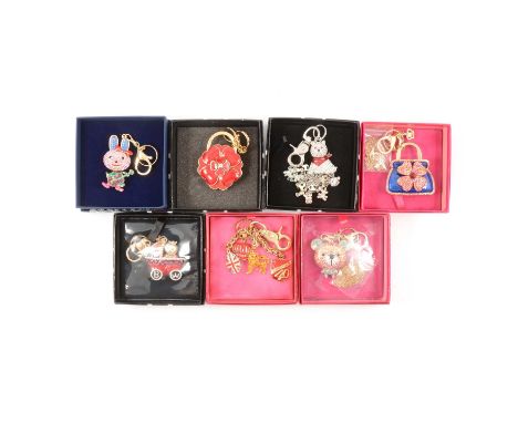 Butler & Wilson - seven large novelty handbag charms/keyrings, blue enamel handbag with red crystal floral detail; Baby in a 