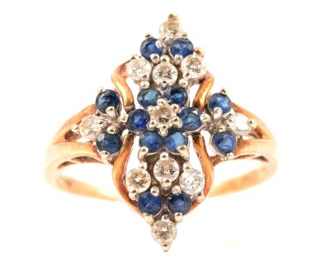 A sapphire and diamond cluster ring, fourteen round faceted sapphires and eleven brilliant cut diamond claw set in a 9 carat 