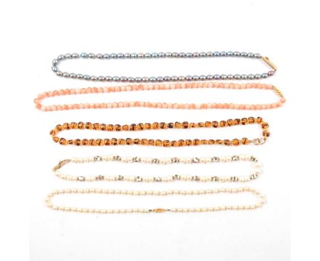 Two cultured pearl necklaces, each 45cm, one having ceramic bead spacers; a black pearl necklace, 50cm; a 6mm pink conch bead