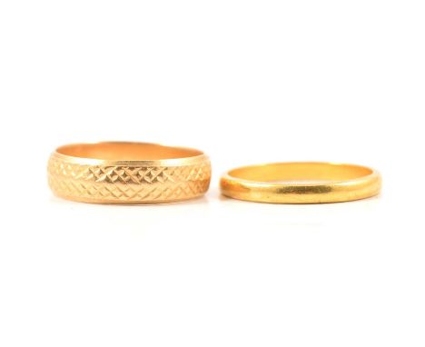 Two gold wedding bands, a yellow metal 2.5mm wide plain polished band ring size P1/2, shank marked 22ct, 2.9g; an 18 carat ye