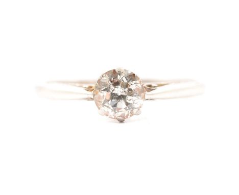 A diamond solitaire ring, the old brilliant cut stone claw set in a white metal mount ring size L1/2, shank marked platinum, 