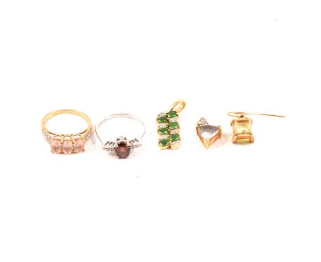 A modern pink topaz three stone ring size K, eight 8 cut diamonds set into each shoulder, 9 carat yellow gold mount, 2.2g; a 