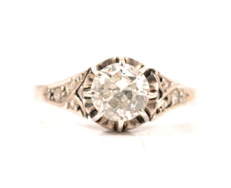 A diamond solitaire ring, the transitional brilliant cut stone claw set in an all white metal mount, ring size K, each should