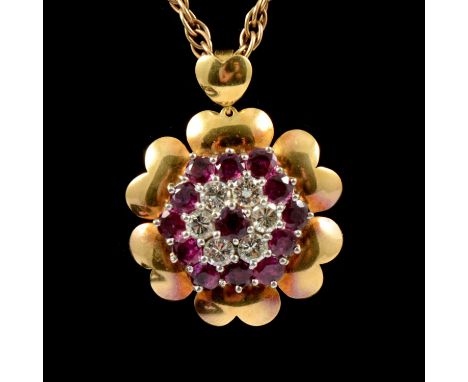 A large ruby and diamond cluster pendant and chain, an 18 carat yellow gold circular pendant claw set with a reverse cluster 