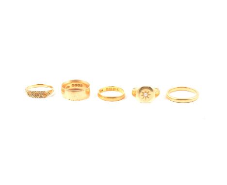 Five gold rings, a 22 carat yellow gold wedding band, plain polished finish 3.2mm wide half D shape size M, London 1953, 2.7g