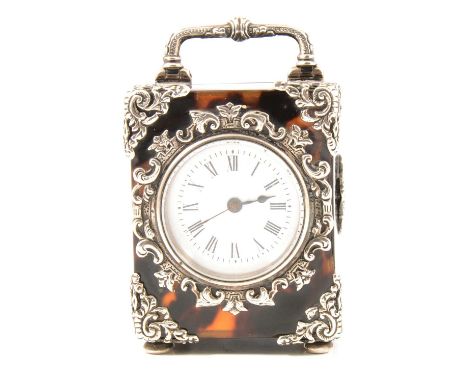 A Victorian silver mounted tortoiseshell timepiece, 42mm white enamel dial with Roman numeral chapter ring in a tortoiseshell