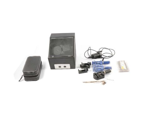 An automatic watch winder, box of stainless steel spring bar lugs and tools.