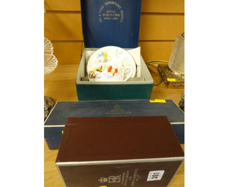 A boxed Royal Worcester cup and saucer, a boxed commemorative goblet and a boxed Royal Worcester dish set
