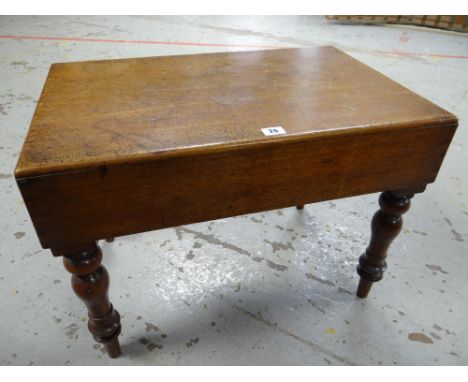 An antique mahogany wash basin