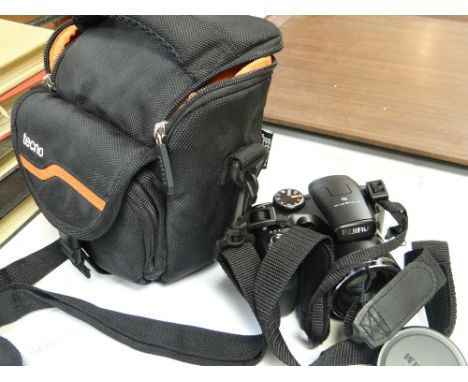 A Fuji Finepix S2900 series digital camera in case