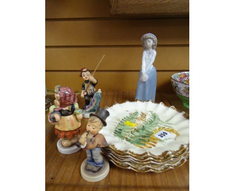 Six E J Bodley dishes, three German pottery figures and a Nao figurine