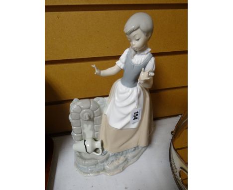 A Nao figure of a child with broken water vessel