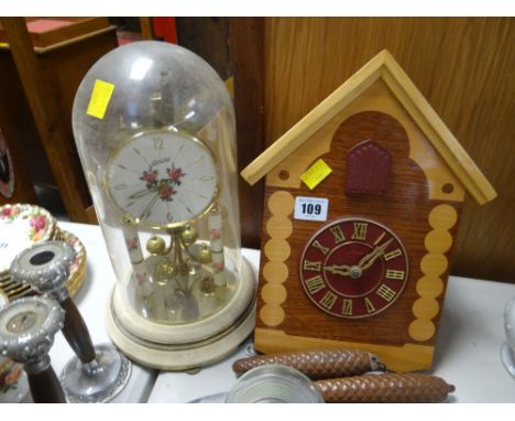 A cuckoo-type clock and a dome clock