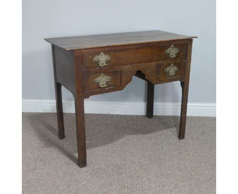 An 18thC oak Low-Boy, rectangular overhung top above one long and two short drawers with original decorative brass handles, r