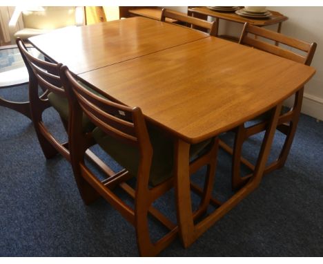 A mid 20thC retro teak extending Dining Table, of a rounded rectangular shape and butterfly style extra leaf, W (extended) 18