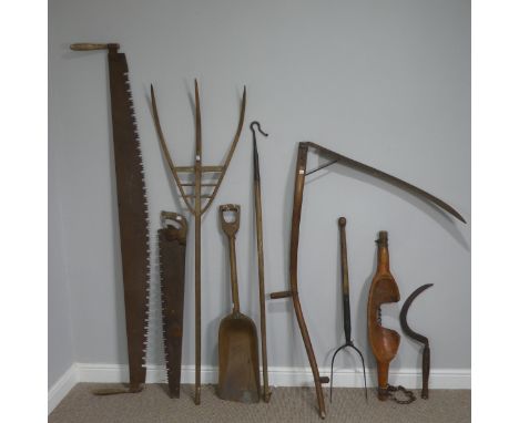 A quantity of antique farming Tools, to include: scythe, grain shovel, hay fork, shoulder yoke, two handed saw, shepherd's cr