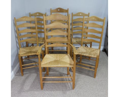 A Set of six Lancashire style ladder-back dining Chairs, including two carvers, all with rush seats, (carvers) W 57 cm x H 11