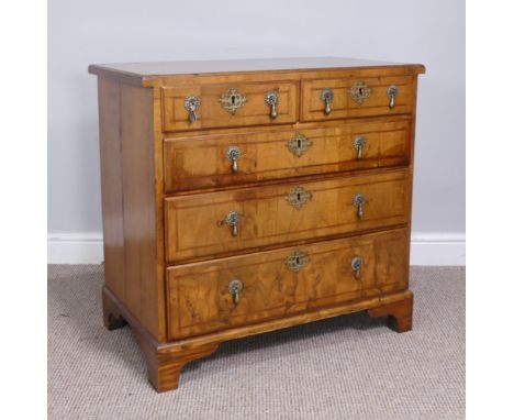 A Late 18thC walnut Chest of drawers, the top with a moulded edge above two short and three long graduated drawers all with o
