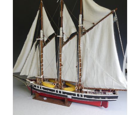 A vintage wooden model three-mast Schooner sailing ship, complete with sails, jibboom, 4 life boats, 2 wooden anchors, ropes,