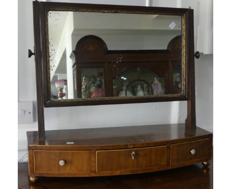 A Georgian toilet Mirror,&nbsp;mirror plate on square tapered supports, the bow-front box base fitted three deep drawers, W 6