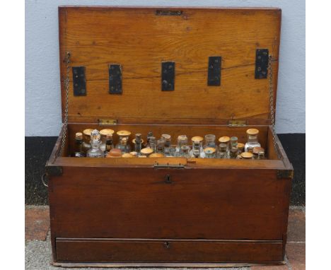 A 19thC mahogany Apothecary Box, the hinged lid opening to reveal an array of approx 60 bottles, containing various medicines
