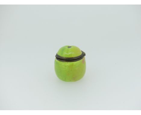 A late 18thC South Staffordshire enamel Bonbonnière, modelled as an apple, decorated in a green ground, H 3.5cm. Provenance; 