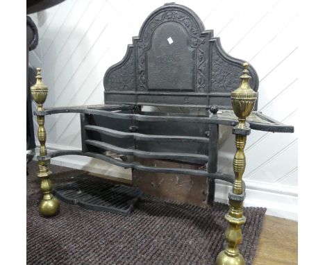 A large Regency style cast iron and brass fire Grate,&nbsp;having arched back, urn finials, and beaded edges, W 96.5 cm x H 8