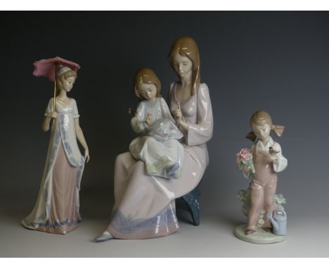 A Lladro porcelain model of 'First Sampler', modelled with mother and child perched on chair, H 30cm, together with Lladro 'S