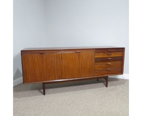 A teak Scandart Sideboard from the 1960s, a Danish design with two opening doors which reveal a large interior with three fix