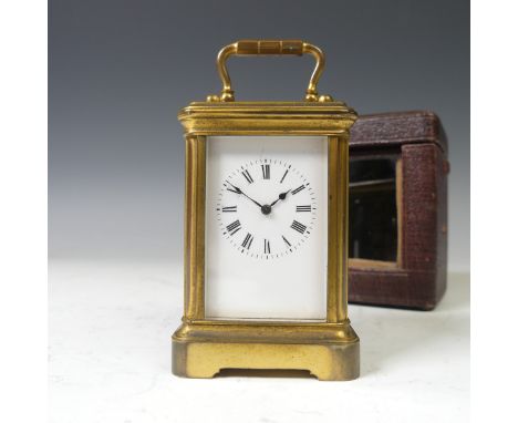 A 19thC French gilt Brass miniature Carriage Clock, of typical five glass form, the unsigned white dial with black Roman Nume