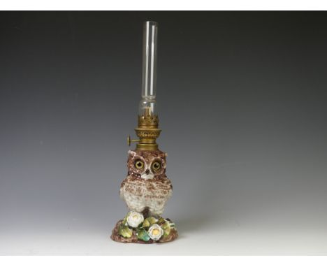 A Victorian porcelain owl oil Lamp Base, c. 1880, the body modelled as an owl perched on flora with impressed registered mark