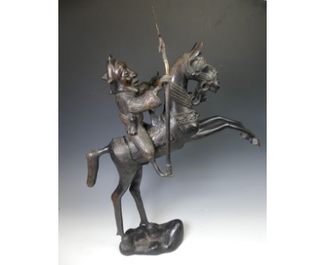 A large West African Benin bronze Statue of a horse and rider, W 49 cm x H 69.5 cm x D 12 cm. 