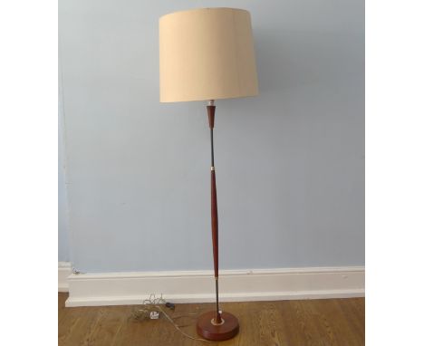 A Retro mid 20thC teak standard Lamp and shade, sold as untested, W 51 cm x H 173 cm x D 51 cm x (base) 24 cm. 