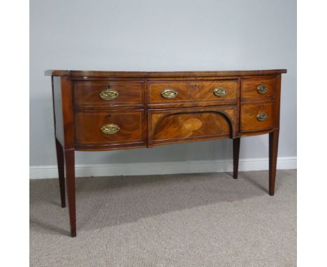 A Georgian mahogany inlaid bow front Sideboard,&nbsp;with one pull out drawer above a shaped deep drawer, flanked by two draw