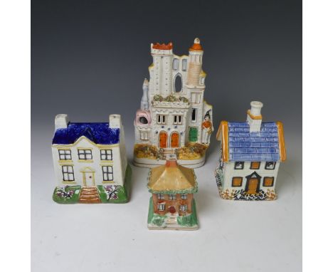 A 19thC prattware Money Box, modelled as a house, together with three other Staffordshire models of buildings, one other also