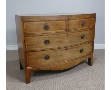 A Georgian mahogany bow-front Chest of drawers, fitted with two short drawers over two long drawers, all cock-beaded and inla
